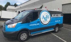 A & H Heating Van in Front of Business Building